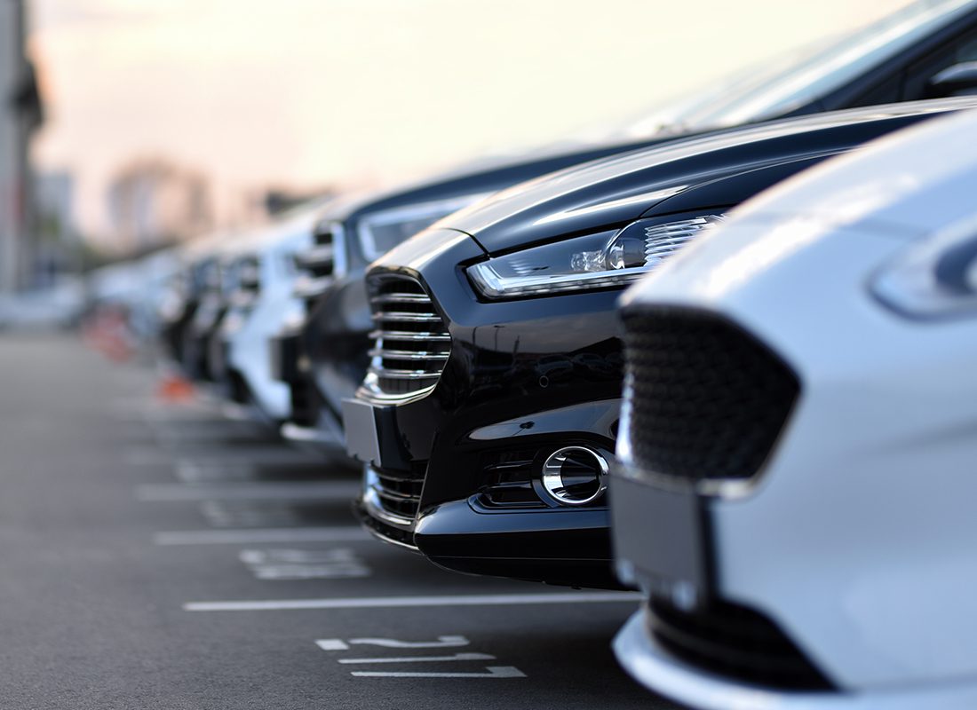 Business Insurance - Close-up of a Group of Rental Cars on a Lot