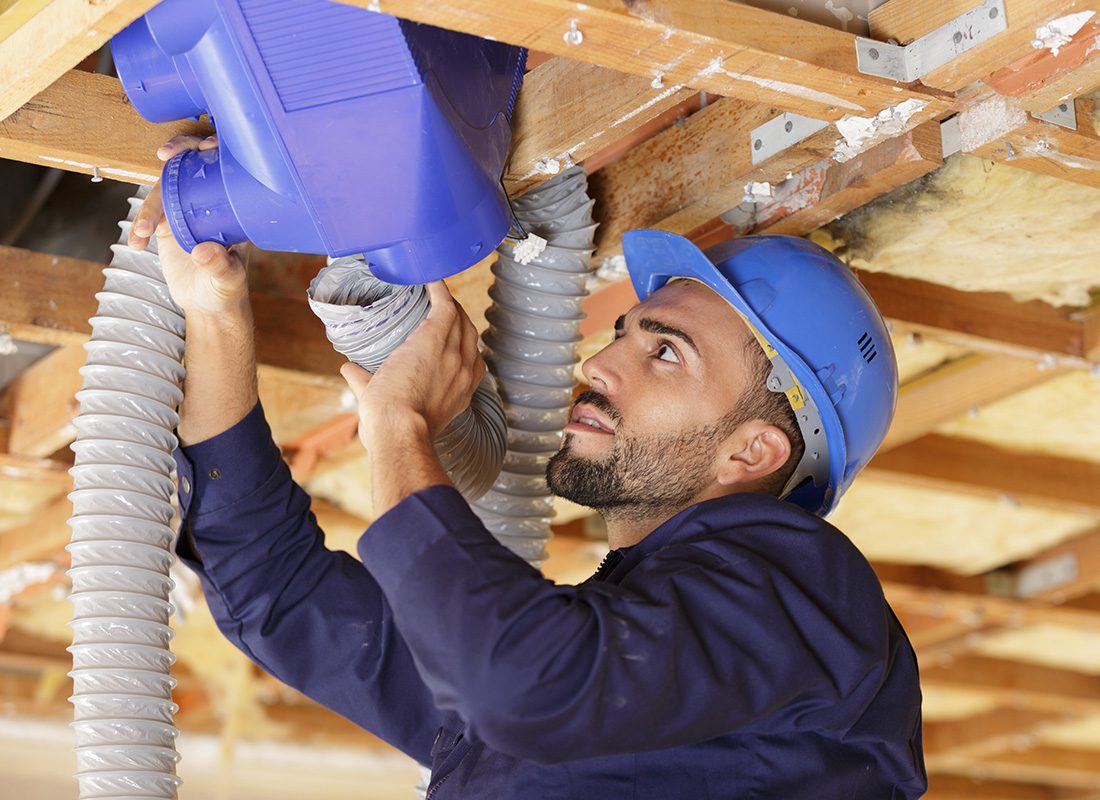 Insurance by Industry - Contractor Installing a Ventilation System at a Home